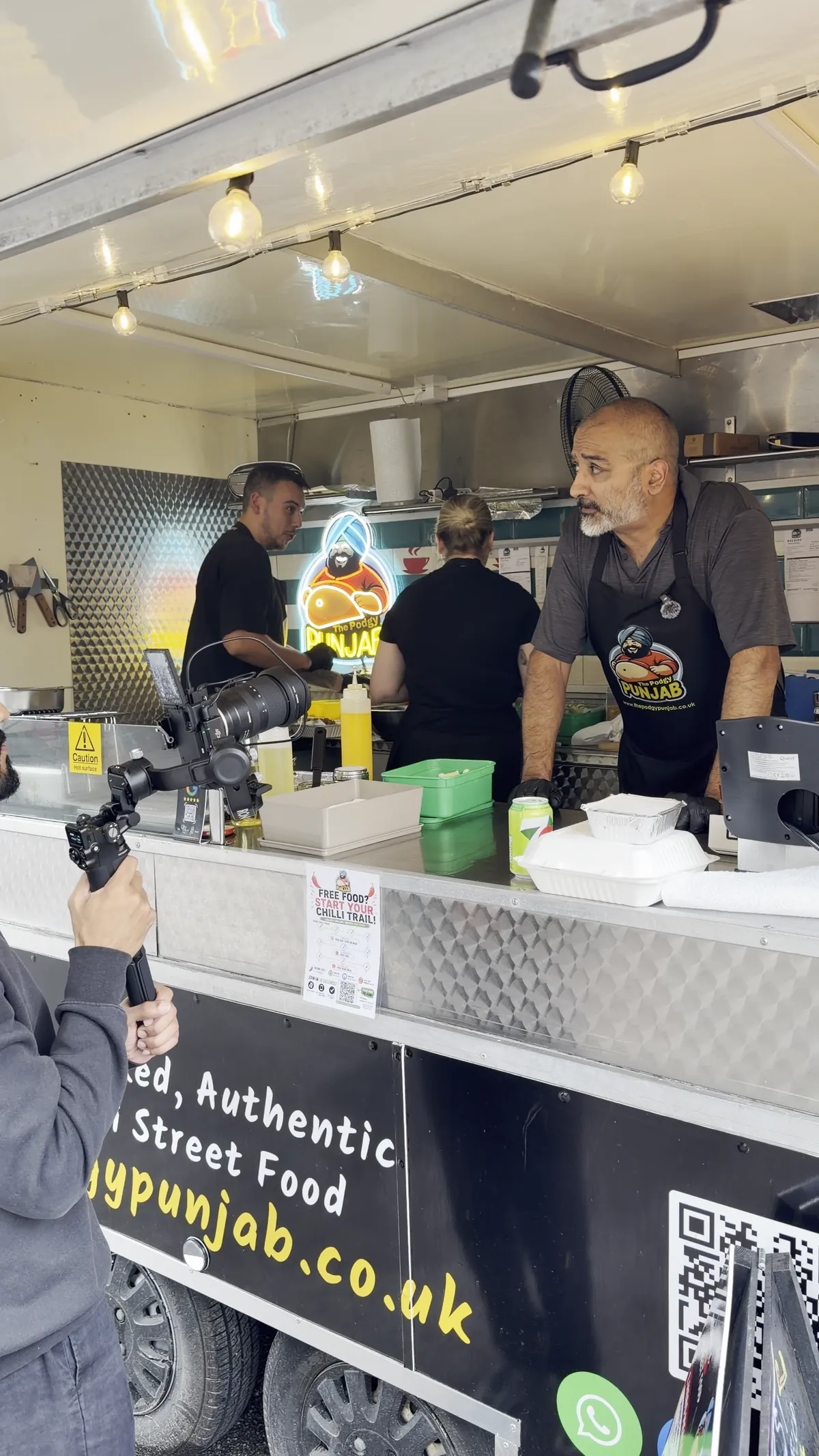 Filming the chef at a street food hatch
