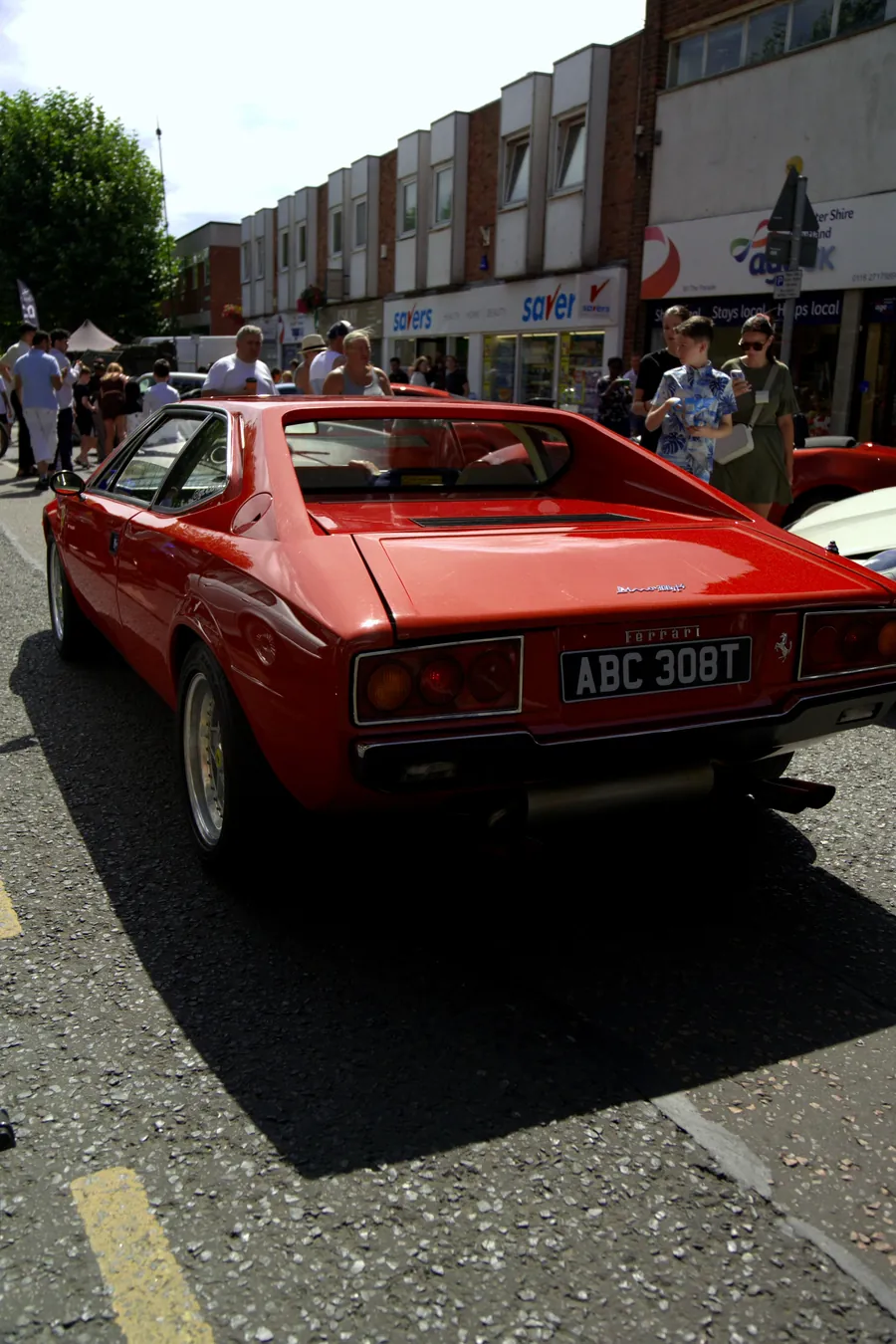 The back of a red Ferrari on the high street