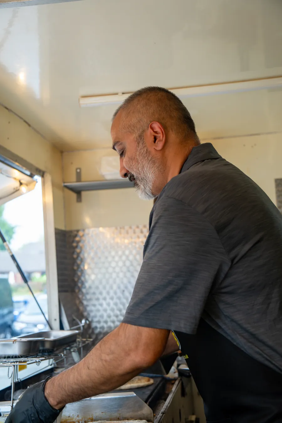 The chef at the hatch window, mid-service