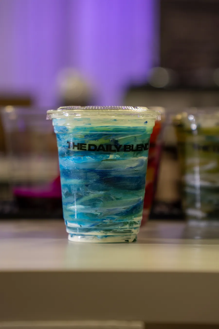 A blue layered smoothie on the counter