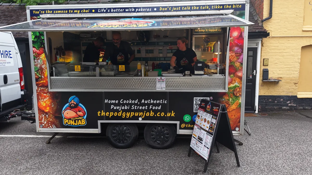 The street food trailer parked up, from the drone